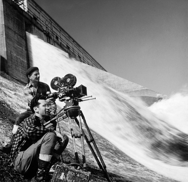 Morten Parker (foreground) and cameraman Ernie Wilson shoot a film on the Gatineau River in Quebec, June 1946. Photo: John Mailer.