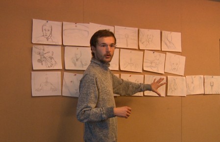 Alex Boya focused on his storyboard.