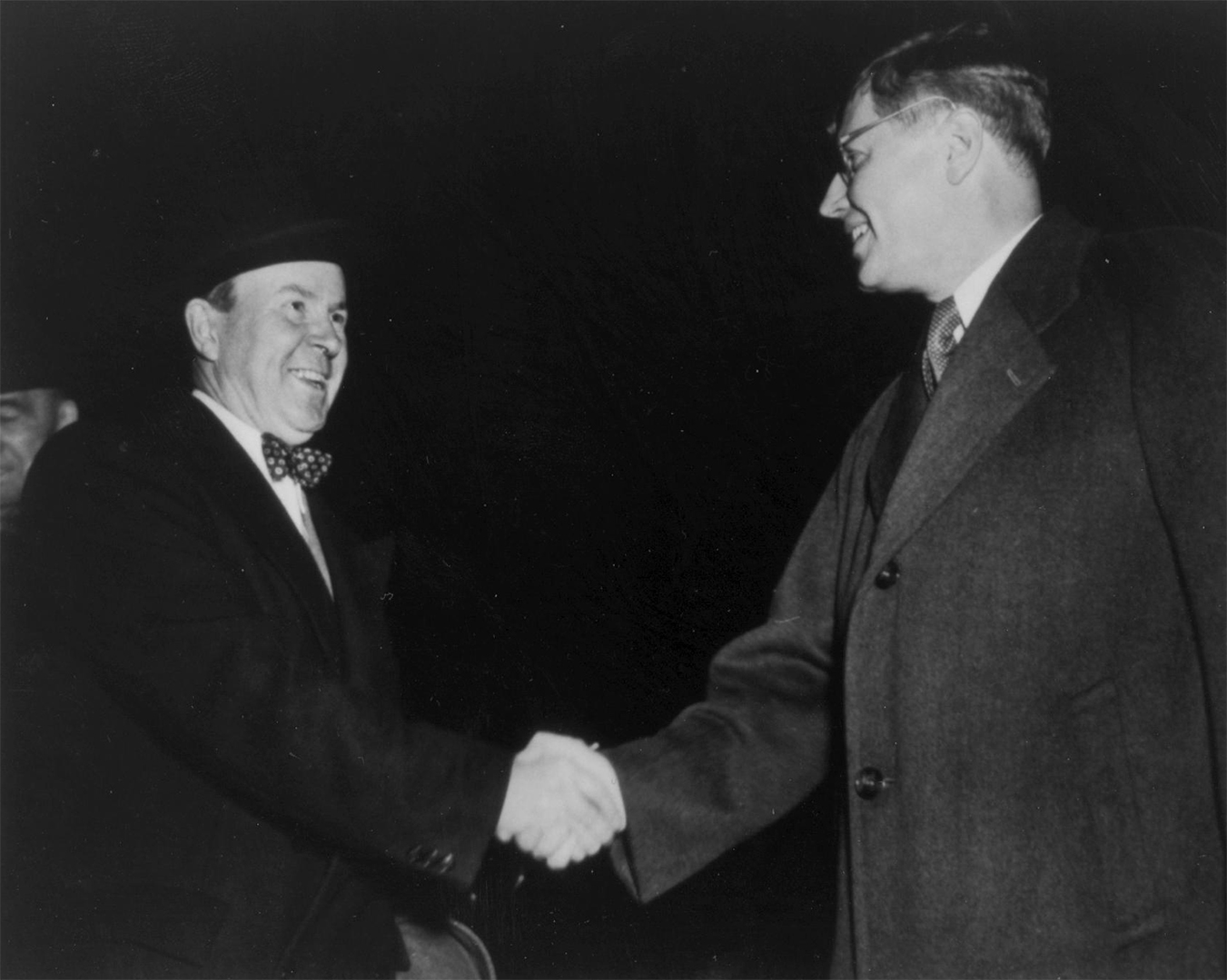 Black and white photograph of Lester B. Pearson and Herbert Norman shaking hands.